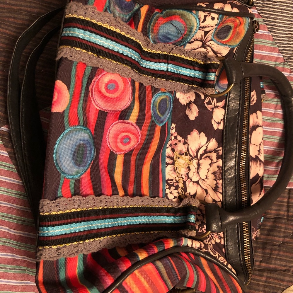 Cute bag.  2 carrying straps shoulder 25” and shorter strap.